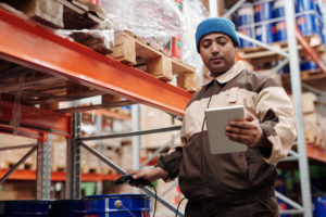 Man in hardware store holding tablet